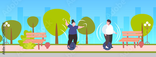 fat obese man woman riding self balancing scooter couple standing on electric gyroscooter personal electrical transport obesity concept urban park landscape background horizontal full length
