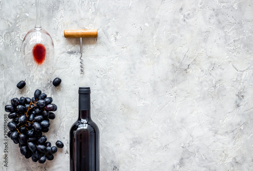 Composition with wine bottle on grey background top view copy space