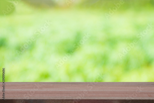 Wooden table top on blur background - can be used for display or montague your products.Mock up for display of product.