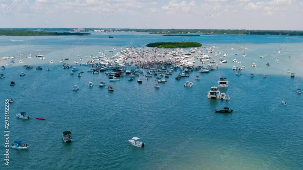 Aerial view of boats surrounding annual sand bar party near John's Pass Boardwalk located in Madeira Beach, Florida. Aerial view of boats surrounding annual sand bar party near John's Pass Boardwalk located in Madeira Beach, Florida.