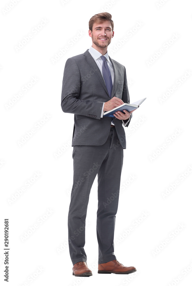 in full growth. successful businessman with a notebook. in full growth. successful businessman with a notebook.