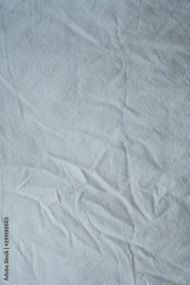 Naklejka premium Background material. A white wrinkled sheet.