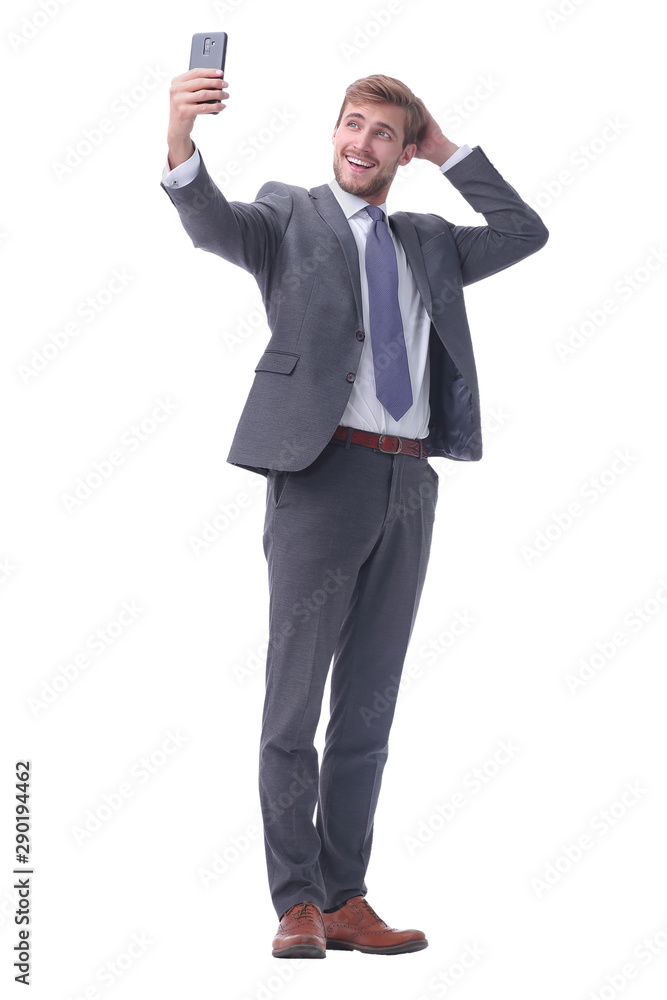 in full growth. smiling businessman taking selfie. in full growth. smiling businessman taking selfie.