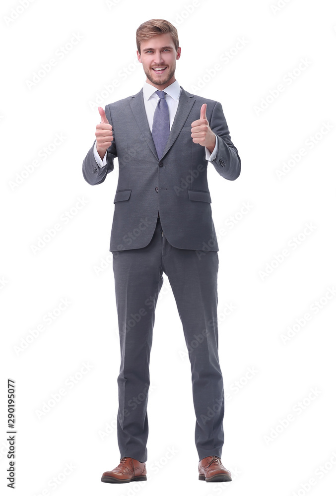 in full growth. happy businessman showing thumbs up. in full growth. happy businessman showing thumbs up.