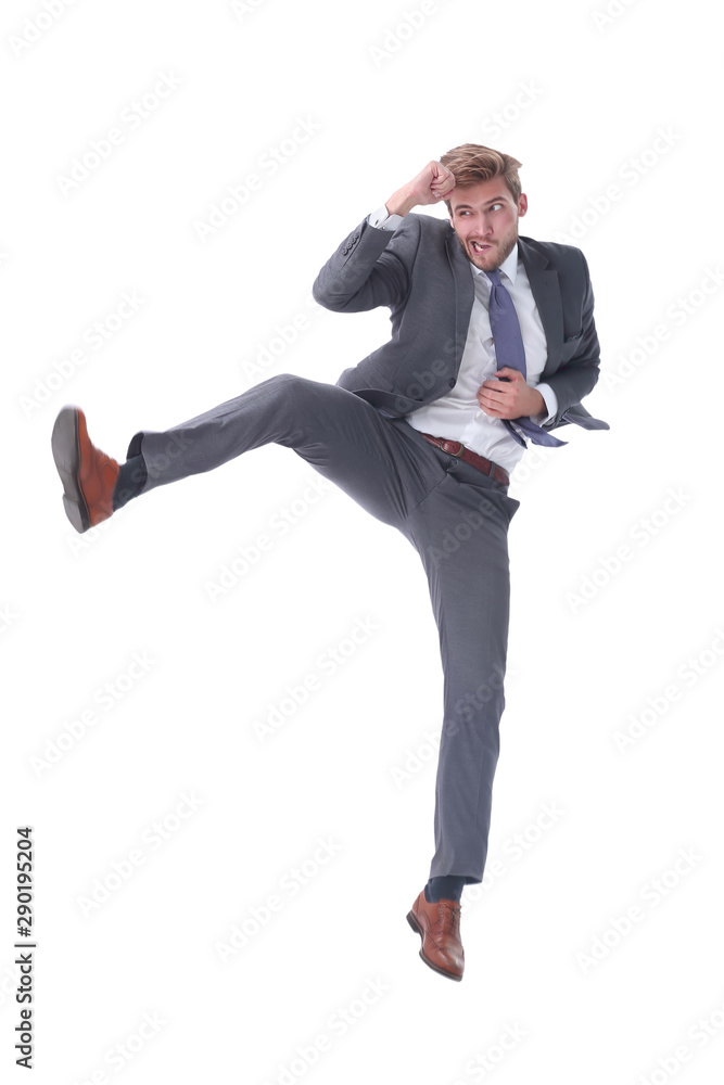 in full growth. young businessman jumping high. in full growth. young businessman jumping high.