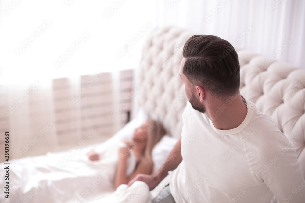 close up. young couple in the bedroom in the morning close up. young couple in the bedroom in the morning