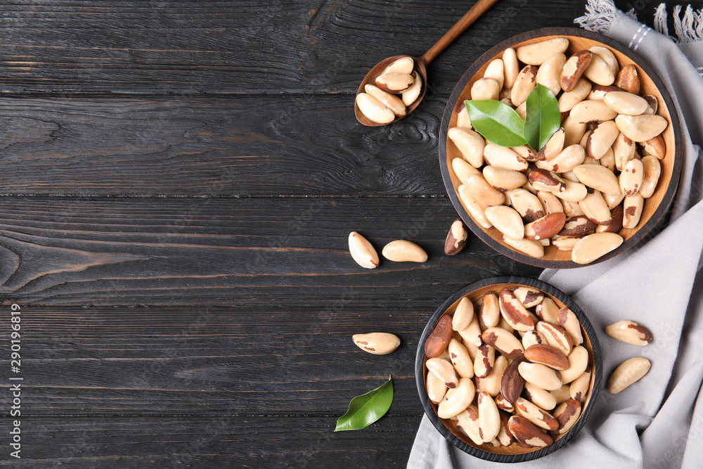 Flat lay composition with Brazil nuts and space for text on wooden background Flat lay composition with Brazil nuts and space for text on wooden background