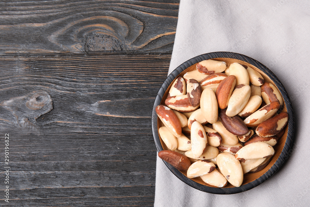Flat lay composition with Brazil nuts and space for text on wooden background Flat lay composition with Brazil nuts and space for text on wooden background
