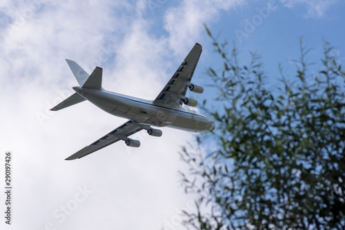 huge cargo transport plane takes off in the sky