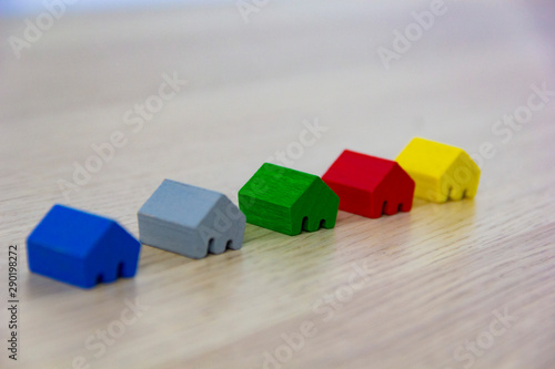 different colored game pieces representing different houses, concept of choice and diversity