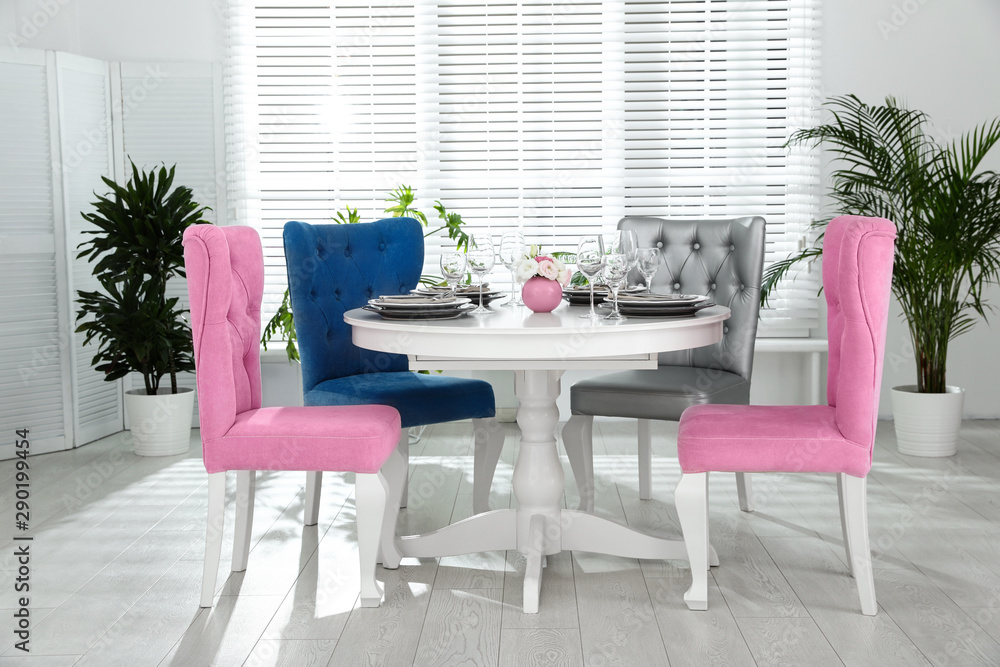Fototapeta premium Elegant dining room interior with stylish chairs and table