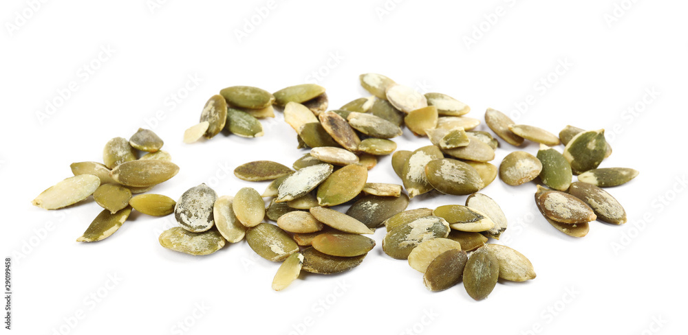 Raw peeled pumpkin seeds on white background Raw peeled pumpkin seeds on white background