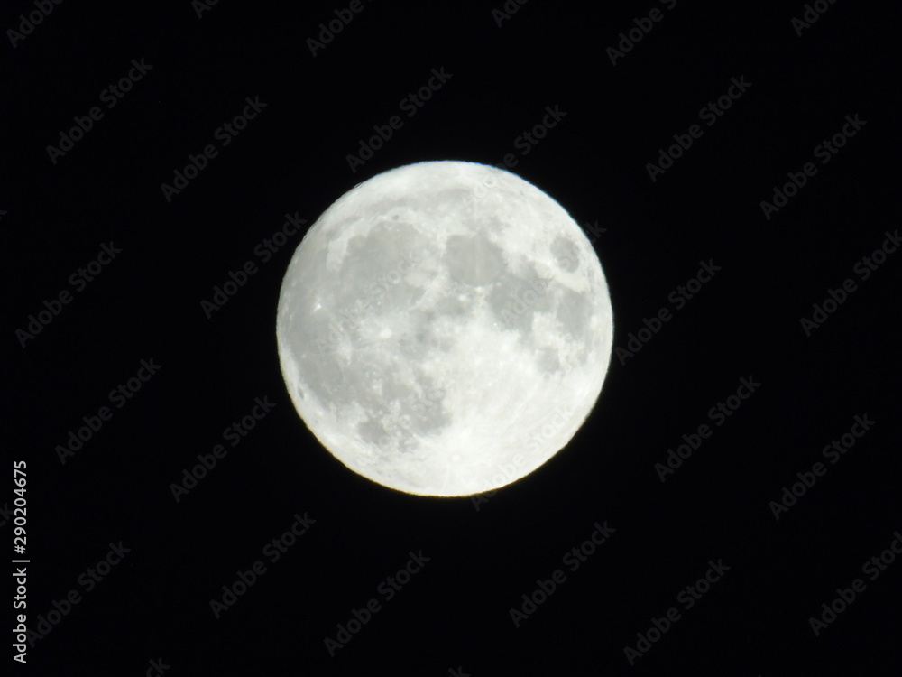 An amazing photography of the full moon over the city of Genova by night with a great clear sky in background and some stars An amazing photography of the full moon over the city of Genova by night with a great clear sky in background and some stars