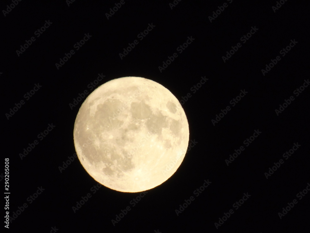 An amazing photography of the full moon over the city of Genova by night with a great clear sky in background and some stars An amazing photography of the full moon over the city of Genova by night with a great clear sky in background and some stars