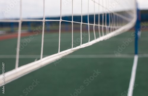 Volleyball net close - up on the background of the Playground.