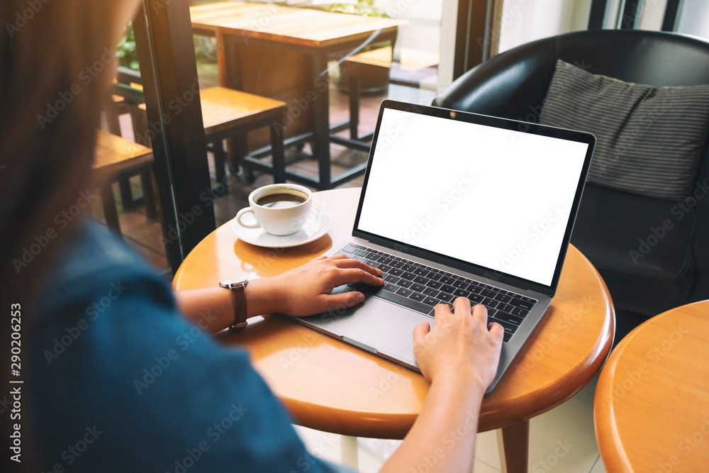 Mockup image of a woman using and typing on laptop keyboard with blank white desktop screen Mockup image of a woman using and typing on laptop keyboard with blank white desktop screen