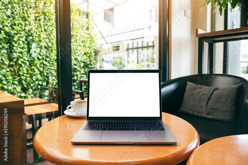 Wallpaper Mural Mockup image of laptop computer with blank white desktop screen on wooden table Torontodigital.ca