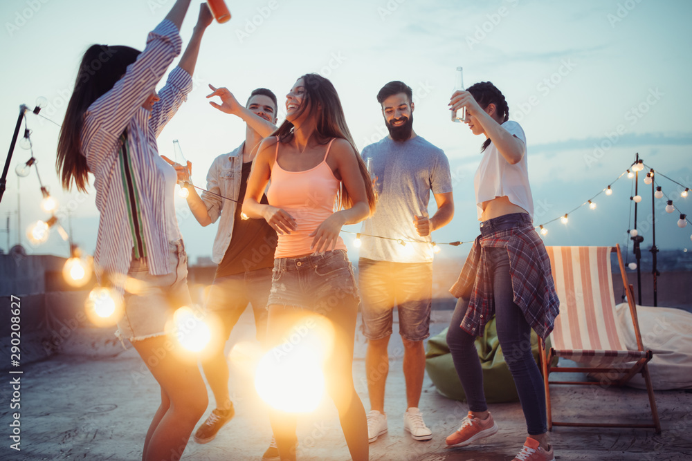 Group of young happy friends having party and fun - obrazy, fototapety, plakaty 