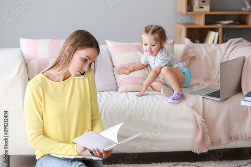 Working mother with her dau...