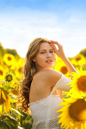 Beautiful young woman in su...