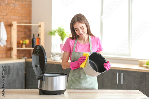 Woman cleaning modern multi...