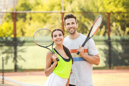 Young couple on tennis court