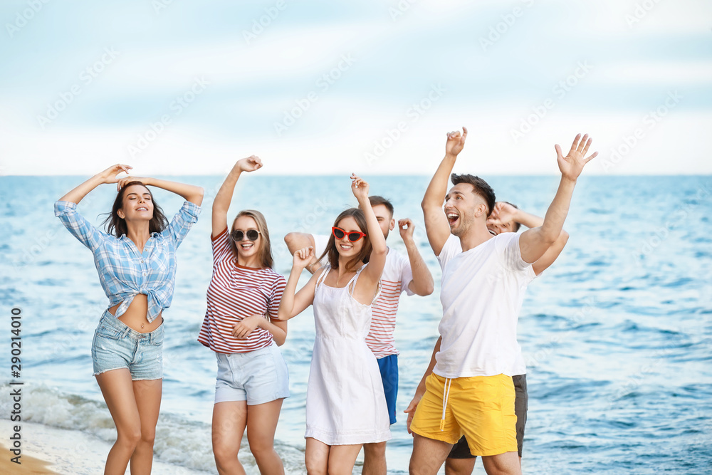 Happy friends on sea beach at resort Happy friends on sea beach at resort