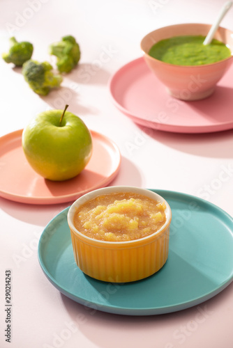 Natural baby food concept. Bowl of apple baby puree.