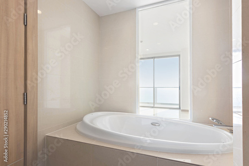 Clean and white Bathroom with Amenities in Luxurious Apartment.