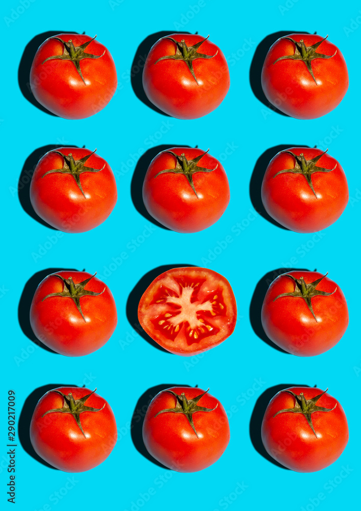 Food pattern with tomato. Creative poster with tomato on blue background. Food flat lay. Food pattern with tomato. Creative poster with tomato on blue background. Food flat lay.