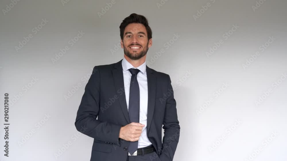businessman talking in front of a gray background businessman talking in front of a gray background
