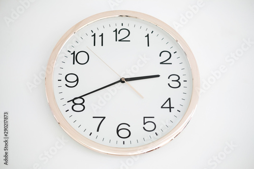 Round wall clock with white body isolated