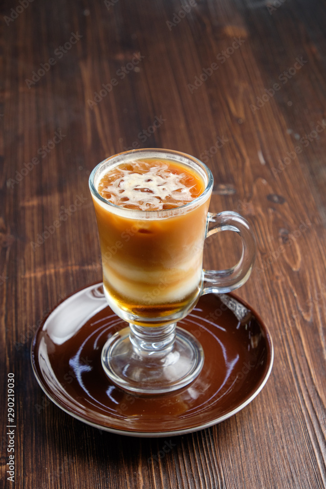 Cappuccino on a brown wooden background. Menu