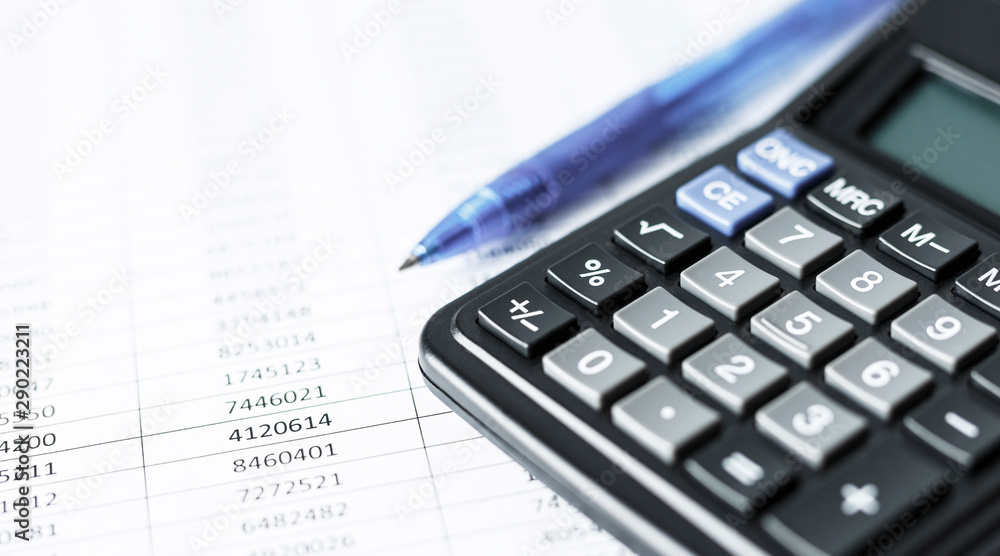 Calculator on white paper with numbers. Business and Finance accounting concept. Calculator on white paper with numbers. Business and Finance accounting concept.