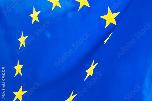 Political relationships. Flag of European Union. Close-up with yellow stars and blue color.