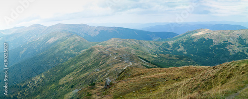 Fototapeta Naklejka Na Ścianę i Meble -  Old and beautiful Carpathian mountains.  Mountain ridge road