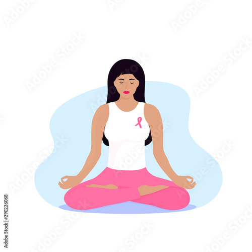 National Breast Cancer Awareness Month. Young woman with a pink ribbon on her chest is meditating