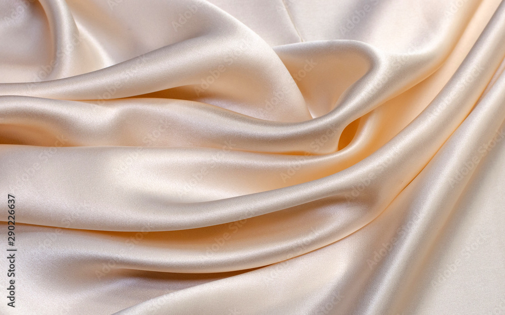 Texture, background, pattern. Light beige silk fabric for sewing
