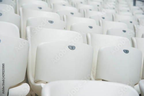 Empty white seats in stadium