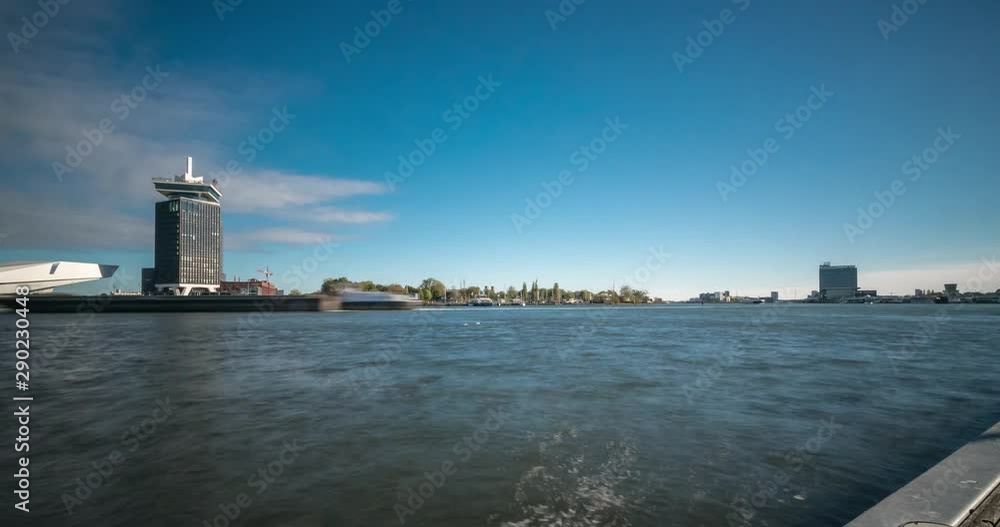 Timelapse video of ferries arriving and departing on the IJ river, next to the Central Railway station of Amsterdam, the Netherlands Timelapse video of ferries arriving and departing on the IJ river, next to the Central Railway station of Amsterdam, the Netherlands