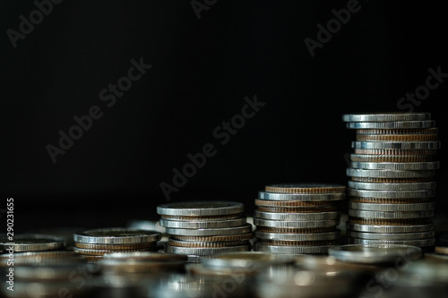 Financial investment concept, Double exposure of city night and stack of coins for finance investor, Forex trading candlestick chart economic , ECN Digital economy, business, Bokeh light.