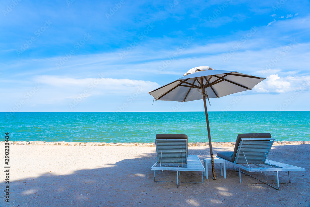 Beautiful umbrella and chair around beach sea ocean with blue sky for travel Beautiful umbrella and chair around beach sea ocean with blue sky for travel