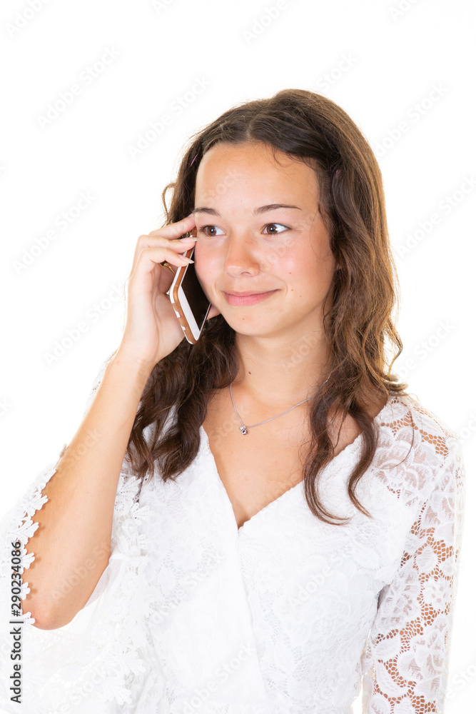 Beautiful young girl looking aside talking on the phone in white Studio isolated background Beautiful young girl looking aside talking on the phone in white Studio isolated background