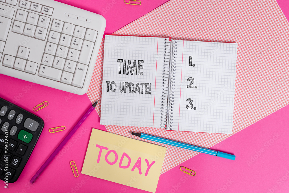 Writing note showing Time To Update. Business concept for this right moment to make something more modern Writing equipments and computer stuffs placed above colored plain table Writing note showing Time To Update. Business concept for this right moment to make something more modern Writing equipments and computer stuffs placed above colored plain table