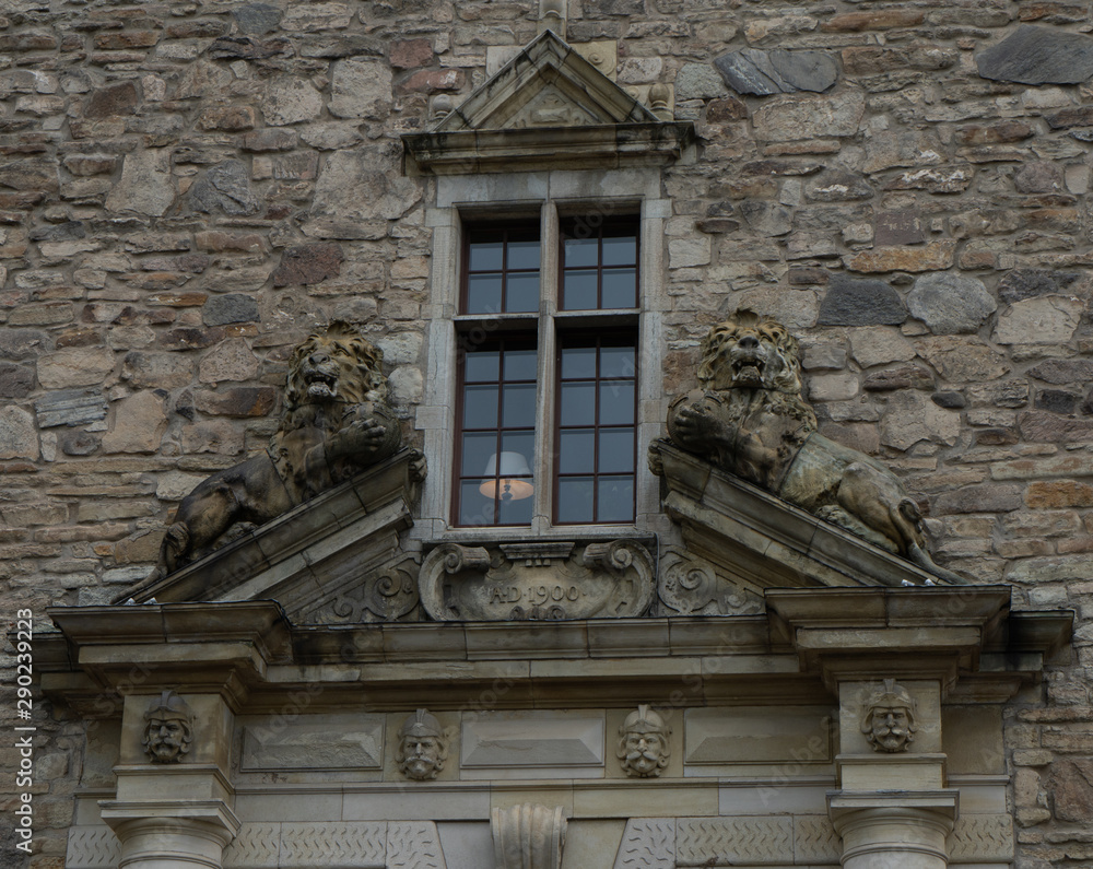 Window with lions in old, stone wall. Orebro castle. Travel photo, background image or illustration.