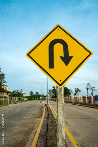 u-turn traffic  sign  with blue sky background