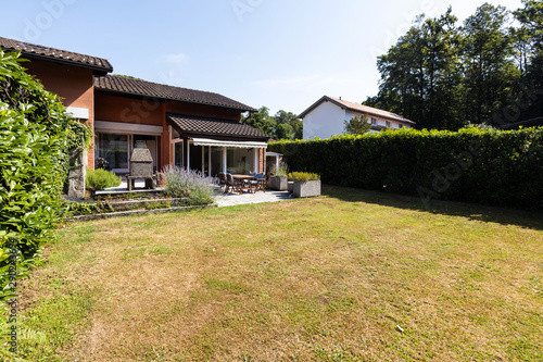 Green garden of a single family home on a summer day