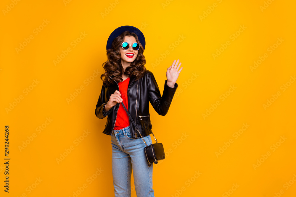 Bye-bye wonderful city. Photo of pretty lady leaving home saying good-bye foreign friends wear stylish outfit with shoulder clutch isolated yellow background Bye-bye wonderful city. Photo of pretty lady leaving home saying good-bye foreign friends wear stylish outfit with shoulder clutch isolated yellow background