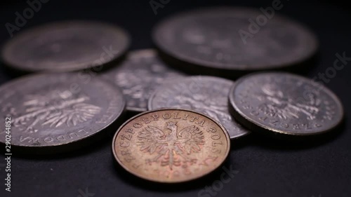 Close Up Of Poland’s Money Coins Rotating On Black Background. photo