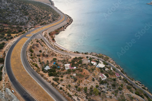 Intersection of two winding roads and coastline of the sea in the morning